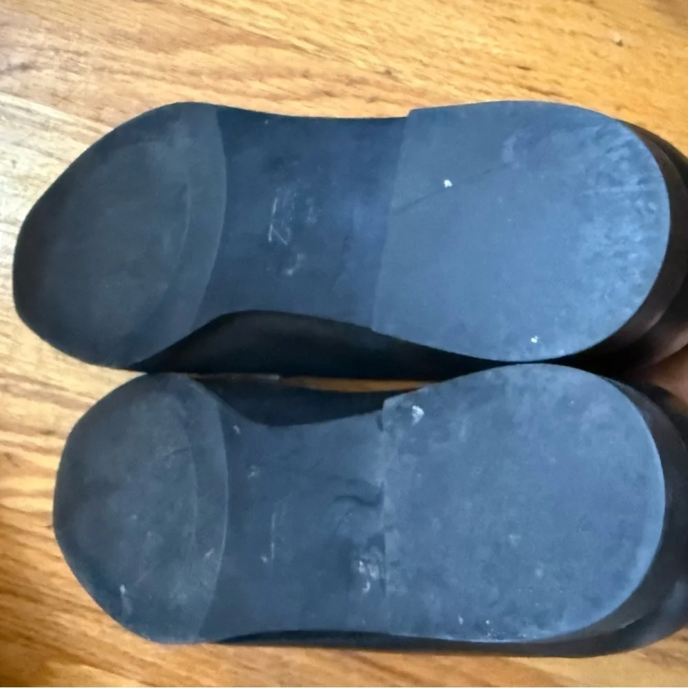 Zara Black Leather Slip on Loafers with Gold Horsebit Buckle Trim.